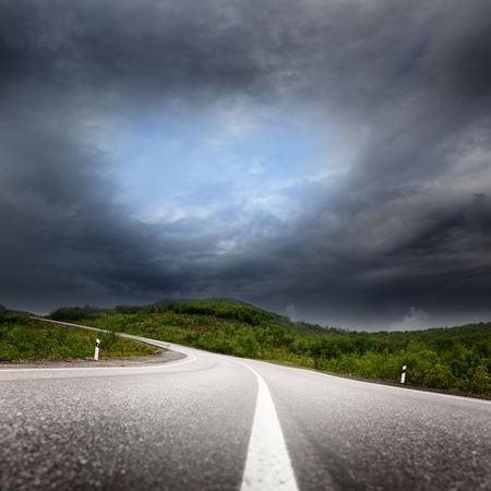 road and black cloudsの写真素材