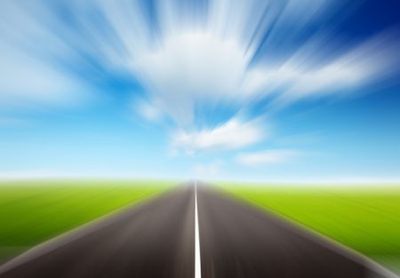 green field and motion blur roadの写真素材