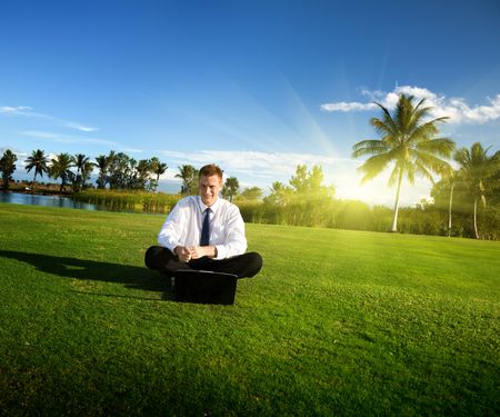 happy young businessman and sunsetの写真素材