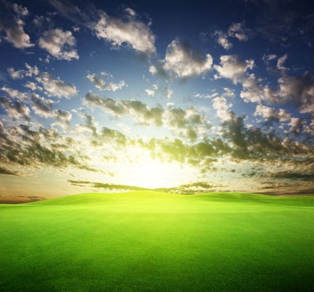 field of grass and perfect sunset skyの写真素材