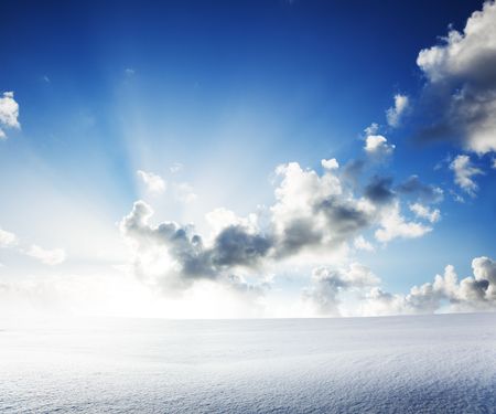 field of snow and cloudy skyの写真素材