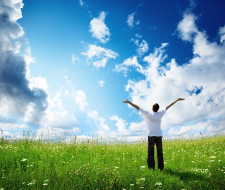 field of grass and happy young manの写真素材