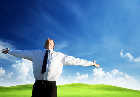 happy young businessman and sunsetの写真素材