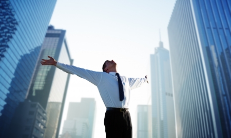 happy young businessman and big city happy young businessman and big city