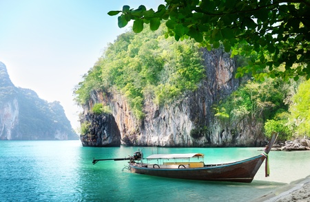 long boat on island in Thailandの写真素材