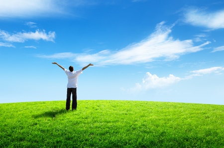happy young man on green fieldの写真素材