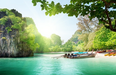 long boats on island in Thailandの写真素材