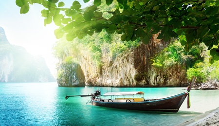 long boat on island in Thailandの写真素材