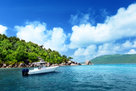 speed boat on the beach of La Digue Island, Seychellesの写真素材