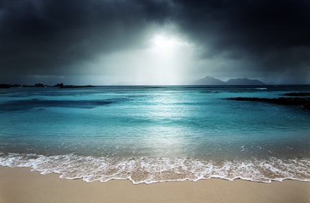 dark sky on the beach of la Digue island, Seychellesの写真素材