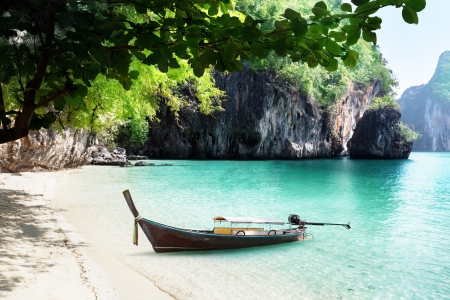 boat on beach of island in Krabi Province, Thailandの写真素材