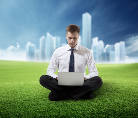 business man working in parkの写真素材