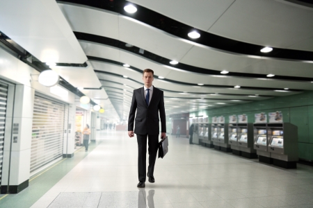 business man walking in subwayの写真素材
