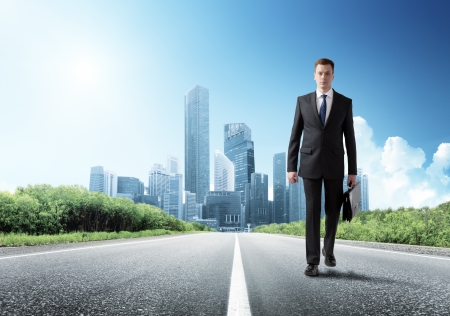 business man walking on the roadの写真素材