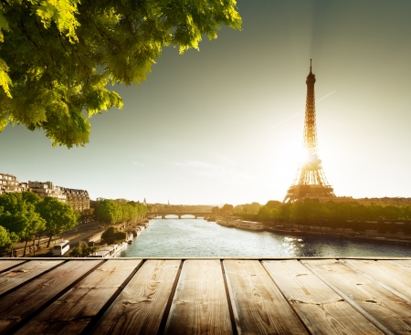 background with wooden deck table and  Eiffel tower in Parisの写真素材