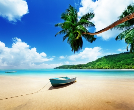 boat on beach Mahe island, Seychellesの写真素材