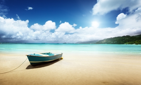 boat on beach Mahe island, Seychellesの写真素材