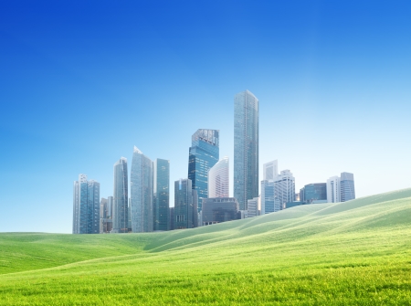 spring field and modern city の写真素材