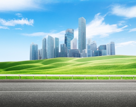 Asphalt road and modern city の写真素材