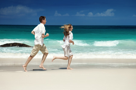 man and woman romantic couple on tropical beachの写真素材