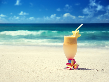 fresh fruit mix of juices on a tropical beachの写真素材