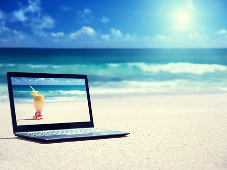 notebook on the beachの写真素材