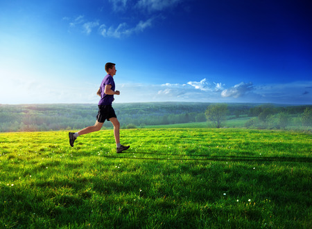 sunset and running young man の写真素材