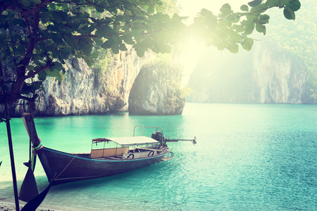 long boat on island in Thailandの写真素材