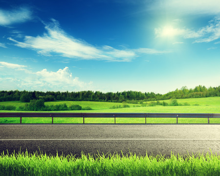 road and spring grassの写真素材