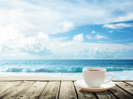 sea and cup of coffeeの写真素材