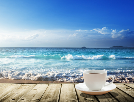 sea and cup of coffeeの写真素材