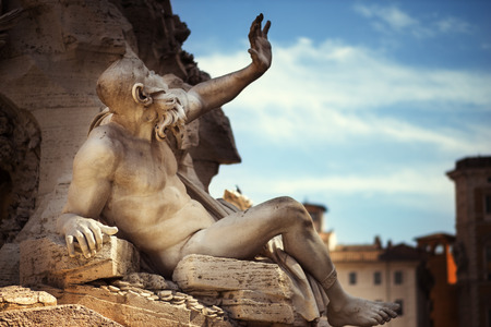 Statue in Fountain, Piazza Navona, Rome, Italyの写真素材