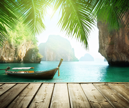 Adaman sea and wooden boat in Thailandの写真素材