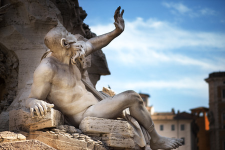 Statue in Fountain, Piazza Navona, Rome, Italyの写真素材