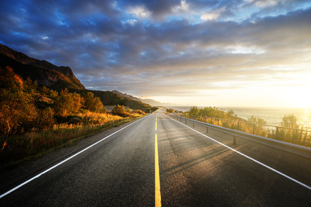 road by the sea in sunrise time,  Lofoten island, Norwayの写真素材