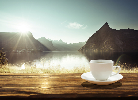 cup of coffee and sunset in Norway, Lofoten islandsの写真素材