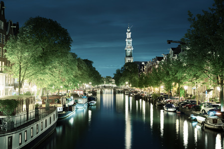 Westerkerk church tower at canal in  Amsterdam, Netherlandsの写真素材