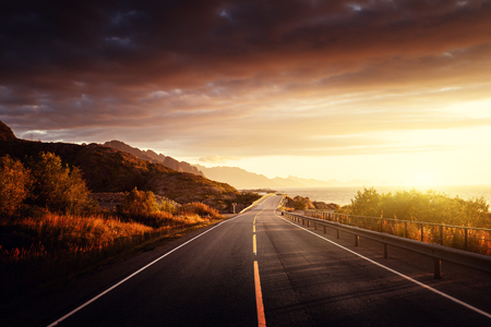 road by the sea in sunrise time,  Lofoten island, Norwayの写真素材