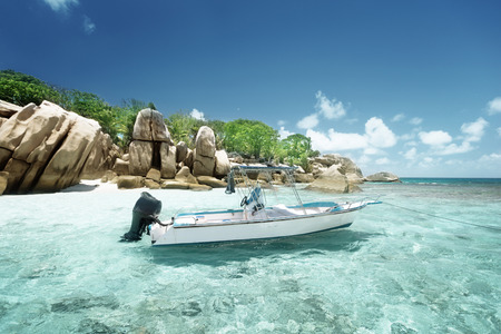speed boat on the beach of Coco Island, Seychellesの写真素材