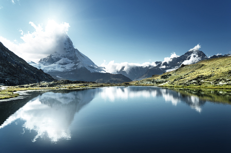 Reflection of Matterhorn in lake Riffelsee, Zermatt, Switzerlandの写真素材