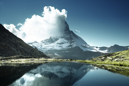 Reflection of Matterhorn in lake Riffelsee, Zermatt, Switzerlandの写真素材