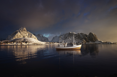 fishing boat and Reine Village, Lofoten Islands, Norwayの写真素材