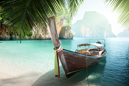 long boat on island in Thailandの写真素材
