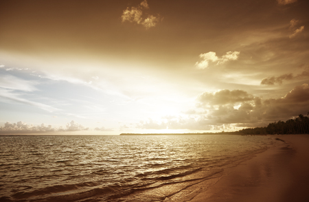 sunset on the beach of caribbean seaの写真素材