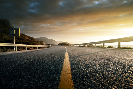 road by the sea in sunrise time, Lofoten island, Norwayの写真素材