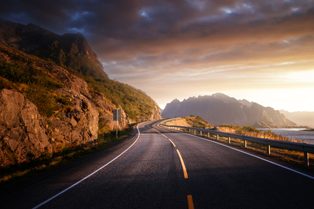 road by the sea in sunrise time, Lofoten island, Norwayの写真素材