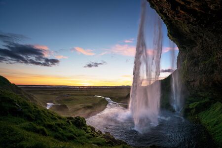 Seljalandsfoss waterfall at sunset, Icelandの写真素材