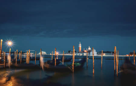 gondolal at night and San Giorgio Maggiore church, Venice, Italyの写真素材