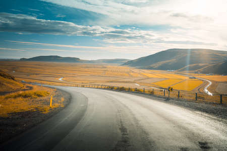 Icelandic landscape with asphalt roadの写真素材