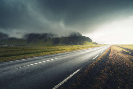 Icelandic landscape with asphalt roadの写真素材